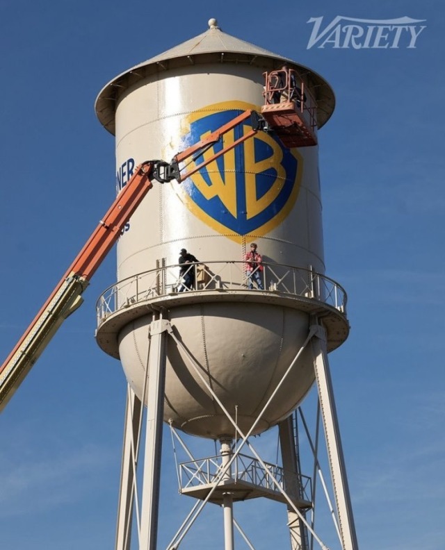 picture from Variety of the WB water tower with Ryan Gosling standing on its platform with the crane that lifted him up there in the foreground